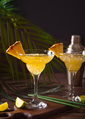 Pineapple margarita cocktail. Summer refreshing tropical drink with pineapple juice and tequila.