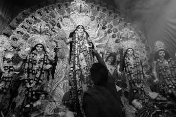 Kolkata, West Bengal, India - 7th October 2019 : Goddess Durga is being worshipped by Hindu priest...
