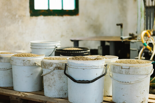 Buckets with pellets in barn