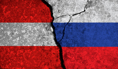 Political relationship between Austria and russia. National flags on cracked concrete background