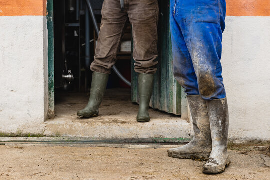 Unrecognizable Farmers Standing Near Building