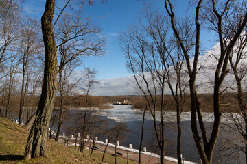 Sozh river embankment in winter. Ice drift. Early spring in Gomel. Gomel palace and park ensemble. View of the embankment from the pedestrian bridge over the Sozh River. Gomel. Belarus