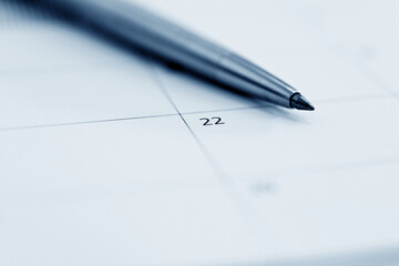 Closeup of pen on calendar
