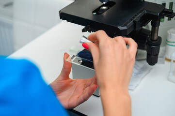 Examination of analyzes using a microscope. Laboratory with microscope