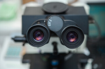 Examination of analyzes using a microscope. Laboratory with microscope