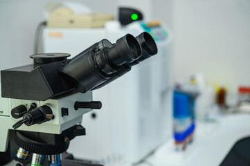 Examination of analyzes using a microscope. Laboratory with microscope