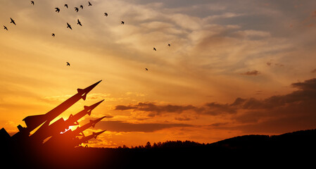 The missiles are aimed at the sky at sunset. Nuclear bomb, chemical weapons, missile defense, a system of salvo fire.