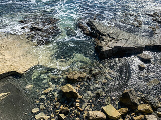Rocky coastline, rocks and stones at the sea