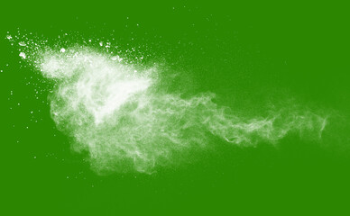 Explosion of white powder isolated on green background. Abstract colored background. holi festival.