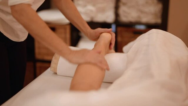 Hand pressing elbow for revival at yogic healing spa