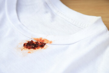 Dirty sauce stain on fabric from accident in daily life. dirt stains for cleaning work house