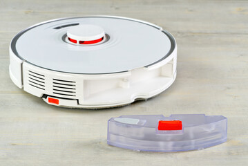 robot vacuum cleaner water tank removed. Smart cleaning and washing technology. advanced robot work to vacuum then mop. close up