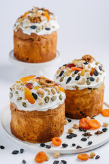 Easter cakes with nuts and dried fruits. White background