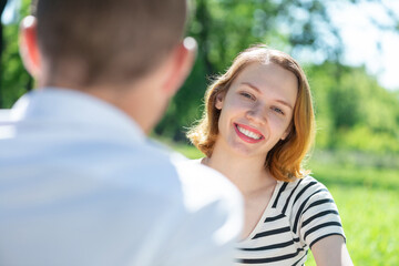 Fototapeta premium Young couple on a date in the park