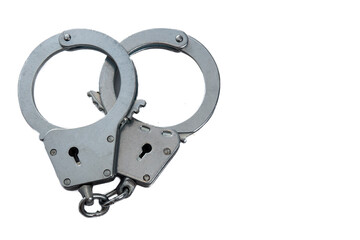 Metal handcuffs on a white isolated background, copy space