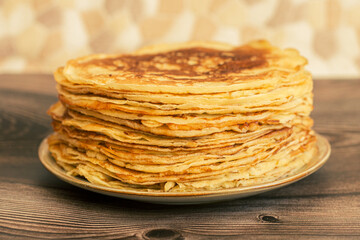 Delicious pancakes with chocolate sauce fresh blueberries on a rustic wooden table. Rustic brown table. 