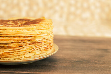 Delicious pancakes with chocolate sauce fresh blueberries on a rustic wooden table. Rustic brown table. 