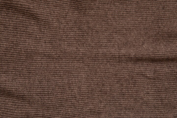 Close up texture of knitted brown fabric cloth