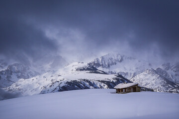 Naklejka na ściany i meble Winter panorama, and isolated chalet in the snow,Mountains Pyrenees, winter scene, France, Ariege. High quality photo