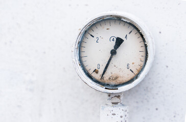 Pressure gauge with pressure on a white industrial background