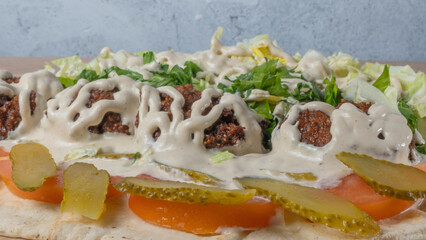 Falafel and fresh salad. Vegan tacos. Vegetarian healthy food. Vegetarian falafel with salad on pita bread.