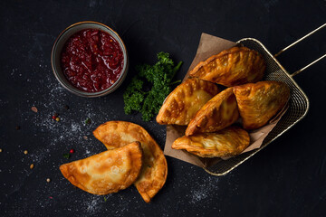 Fried mini pasties, with red sauce, top view, close-up, no people, selective focus,