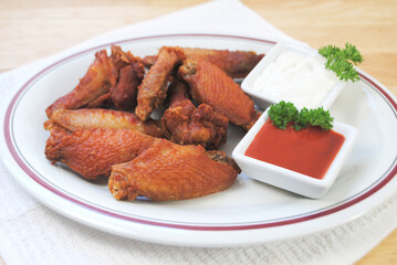 Spicy Deep Fried Buffalo Wings Served with Hot Sauce and Blue Cheese Dressing