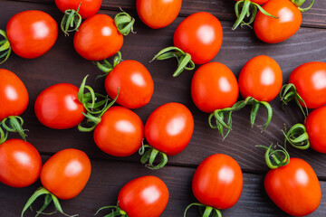 Red tomato on wooden table. Organic healthy food. Cooking Ingredients. Pomodoro on desk close-up