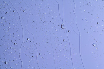 The water was flowing through the blue wall and saw a beautiful pattern.