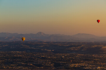 Hot Air Ballon from at sunset with mountain landscape