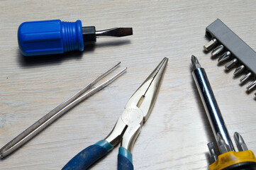 a working tool for minor repairs is laid out on the table
