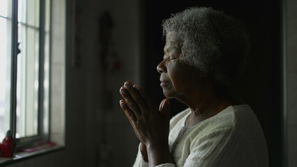 A spiritual African woman praying to God with HOPE