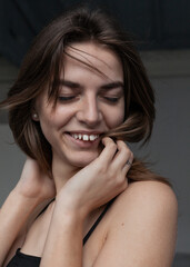 Fototapeta premium portrait of a laughing girl with beautiful hair