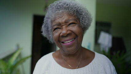 A joyful black senior woman portrait smiling - obrazy, fototapety, plakaty