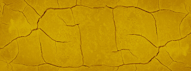 Abstract yellow colored painted colorful damaged broken cracked concrete cement plaster stone wall texture background banner