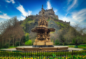 Ross Fountain in garden with Edinburgh Castle on blue sky at United Kingdom