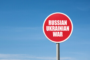 'Russian Ukrainian war' sign in red frame. Blue sky background