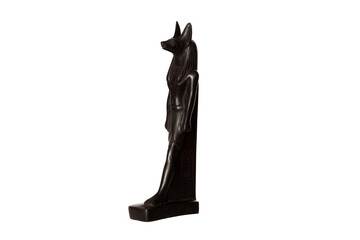 statuette of the Egyptian god Anubis with the head of a jackal isolated on a white background. side view