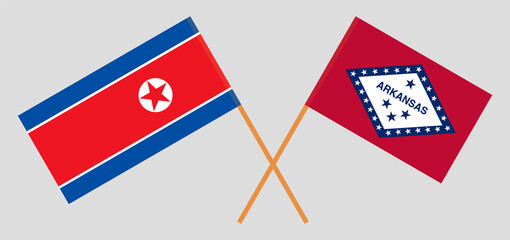 Crossed flags of North Korea and The State of Arkansas. Official colors. Correct proportion