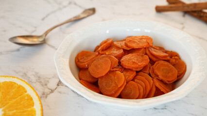 Carrot Tzimmes stew with sweet orange juice in a bowl. Typical Jewish dish food.