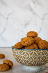 Amaretti cookies in bowl. Small soft Italian traditional sweet-bitter pastry dessert.