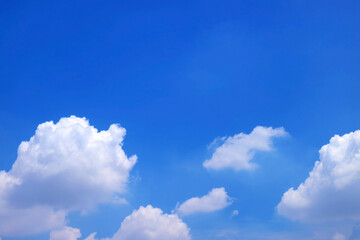 Vivid Blue Sky with Floating Pure White Cumulus Clouds