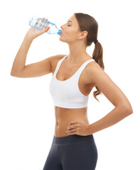 Working towards the body of her dreams.... Studio shot of a sporty young woman isolated on white.