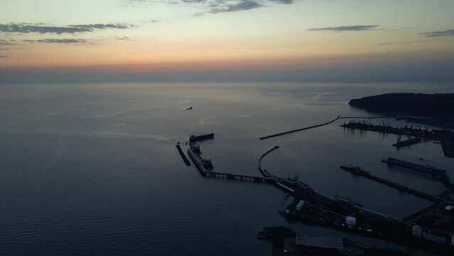 Tuapse commercial sea port at sunset ,shooting from droga