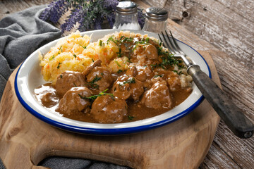 Minced meat balls in mushroom sauce.