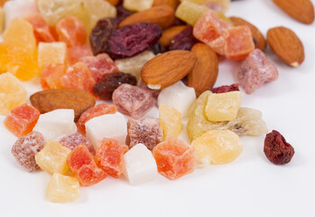 Healthy dried fruits and nuts on a white background.