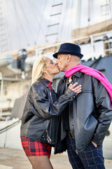 Romantic middle-aged couple kissing in the marina