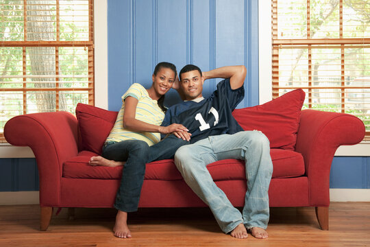 Couple sitting on sofa together