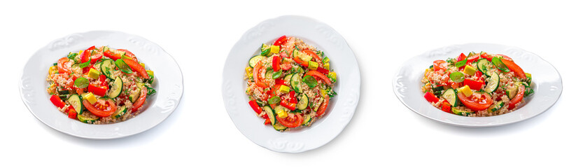 Vegetable salad with quinoa, avocado and fresh herbs is isolated on a white background.