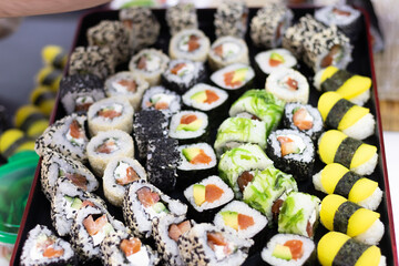 various sushi on a tray, beautiful serving of rolls